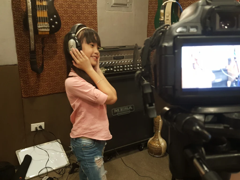 vocal coach teaching student.webp