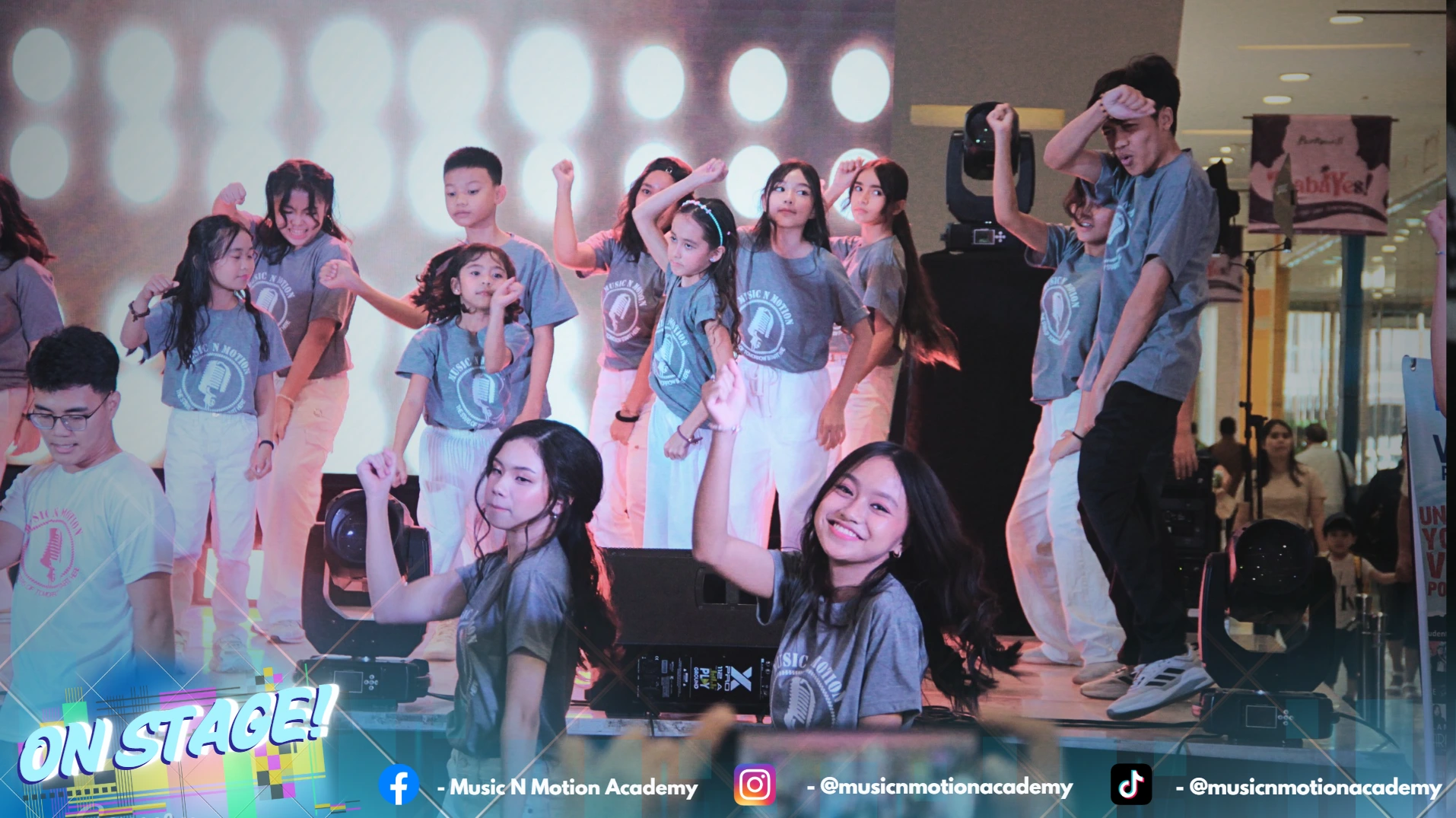 Students performing confidently on stage during a recital at Music N Motion Academy, a music school in Cebu offering voice lessons and real performance experience for kids and beginners.
