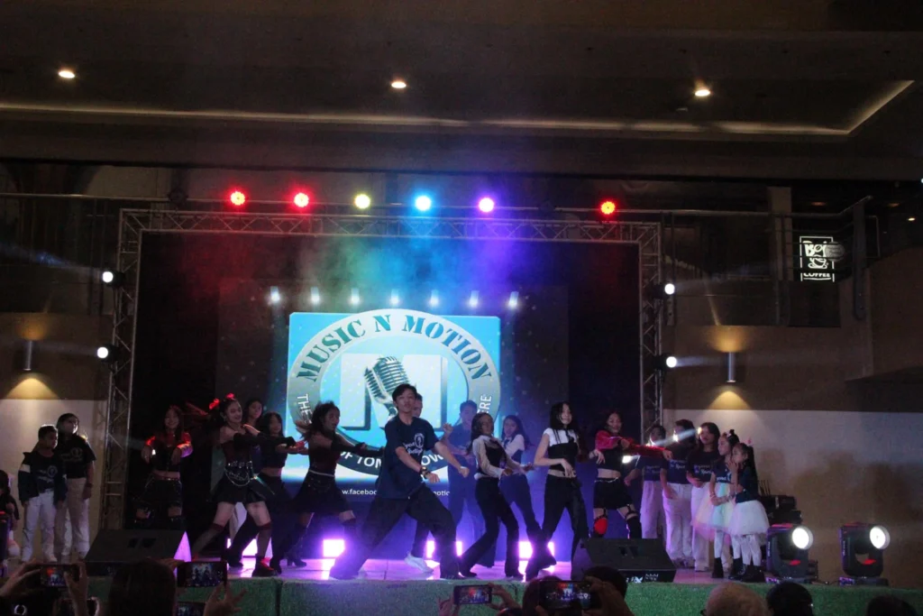 Kids and teens from Music N Motion showcasing confidence and talent during a live recital performance in Mandaue City, Cebu.